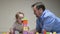 Dad and daughter are building family home. Happy family. Educational games for children. Father and daughter play