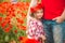 Dad and daughter in a poppy field