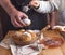 Dad and daughter prepare and eat buns with sugar. Homemade pastries and delicious family breakfast. Morning comfortable at home