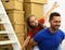 Dad and daughter pretend to fly by pile of boxes