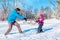 Dad daughter pulling sledges