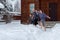 Dad, daughter and son are barefoot running in the snow. Winter day. Hardening is winter fun