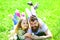 Dad and girl found easter eggs in traditional hunting game in. Man with beard and cute child lay on grass with easter