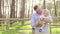 Dad holding kissing his sweet daughter baby with a bow on her head, baby laughs