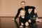 Dad holds a one-year-old daughter on a beige background. Fatherly love. Father`s day