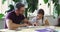 Dad, kid and homework for school, learning and education with book, help and parenting. Homeschool, parent and reading
