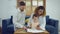 Dad, Mom and little daughter drawing with colorful pencils on paper happy smiling.Young family spend free time together in living