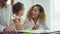 Dad, Mom and little daughter drawing with colorful pencils on paper happy smiling.Young family spend free time together in living