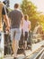 Dad and mum take their children on a stroller to walk and enjoy the beauty of The Bridge Over the River Kwai happily in the