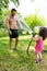 Dad play with little daughter outdoors