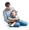 Dad reading a book to kid