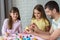 Dad shows children how to easily and easily paint Easter eggs