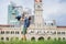 Dad and son on background of Merdeka square and Sultan Abdul Samad Building. Traveling with children concept