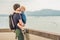 Dad and son in the background of Tropical beach landscape panorama. Beautiful turquoise ocean waives with boats and sandy coastlin