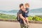 Dad and son in the background of Tropical beach landscape panorama. Beautiful turquoise ocean waives with boats and sandy coastlin