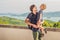 Dad and son in the background of Tropical beach landscape panorama. Beautiful turquoise ocean waives with boats and sandy coastlin