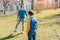 Dad and son playing soccer in park during coronavirus crisis