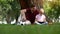 Dad and son reading book, sitting in park under tree, hobby, togetherness