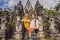 Dad and son tourists on background of Three stone ladders in beautiful Pura Lempuyang Luhur temple. Paduraksa portals