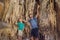 Dad and son tourists in Hang Sung Sot Grotto Cave of Surprises, Halong Bay, Vietnam. Traveling with children concept