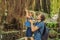 Dad and son travelers discovering Ubud forest in Monkey forest,