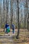 Dad and Sons Walking Through Forest