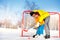 Dad teach little boy son to play ice hockey