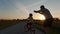 Dad teaches daughter to ride a bike. Happy family childhood dream concept of parent and little kids learn to ride a bike