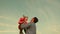 Dad toss up a child skyward. father threw the baby to the sky. happy family concept. dad plays with kid