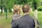 Dad walks with his daughter in park