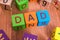 Dad word written with colorful cubes with letters