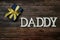 Daddy alphabet letter on wooden background