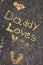 Daddy loves you statement written on concrete