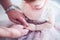 Daddy puts on cute golden finger ring on daughter`s little hand