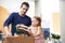 Daddys little helper. A father and daughter packing clothes in a donations box.