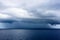 Daek blue sea color and storm raining cloud background.