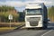 DAF XF105 main tractor with a trailer on a highway on a cloudy day