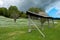 Daffodil meadow with hayrack before a storm