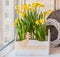 Daffodils in the balcony boxes decorated with angel