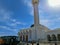 Dahab, Egypt - March 15 ,2012: tourist visiting the mosque with minaret lit by sunset