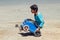 Dahab, Egypt May 11, 2019: little boy rides in a makeshift trolley from a plastic canister