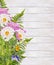 Dahlias flowers and fern bunch on white wooden