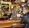 Dahlonega, GA-circa March 17, 2019:  Bartender serves up drinks at the local Irish Pub for St. Patrick`s Day holiday