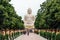 Daibutsu, The Great Buddha Statue in meditation pose or Dhyana Mudra seated on a lotus in open air with trees in foreground.