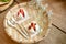 Daifuku Strawberry is a Japanese sweet. Daifuku Strawberry on a plate of bamboo strings