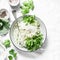 Daikon and kohlrabi cabbage slaw salad on light background