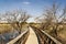 Daimiel tables in Ciudad Real. Lagoons with wooden walkway, blue sky