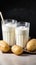 Dairy alternative Two glasses with powdered vegan potato milk showcased