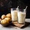 Dairy alternative Two glasses with powdered vegan potato milk showcased