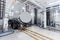 Dairy factory industry, milk tanker truck pumps products into steel storage tanks